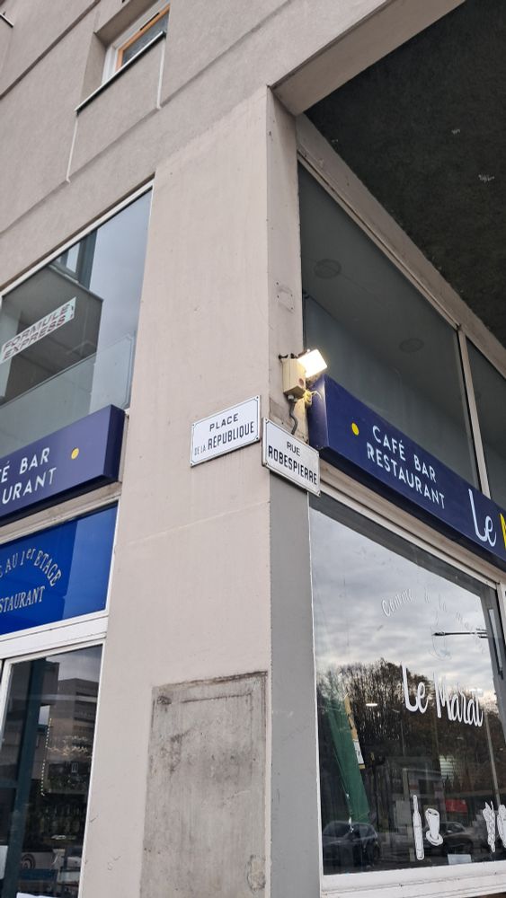 Place de la Republique and Rue Robespierre street signs