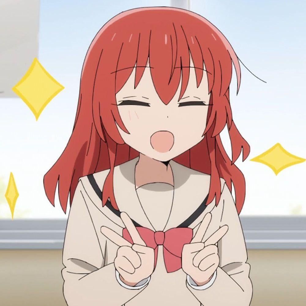 Kita Ikuyo from Bocchi the Rock. She's smiling and doing a double peace sign while surrounded by sparkles.