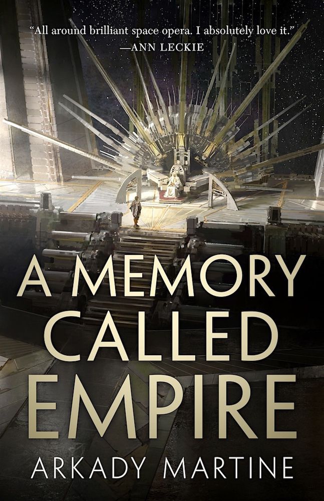 The cover of A Memory Called Empire by Arkady Martine. It depicts a person standing before someone seated on a grand throne. Spokes radiate from the throne making it resemble a sun.