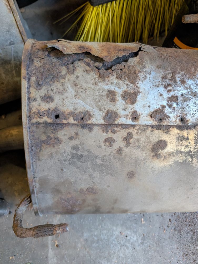 Embarrassing muffler #2: Slightly less rust-riddled, with a slightly less ghastly rift at one end.