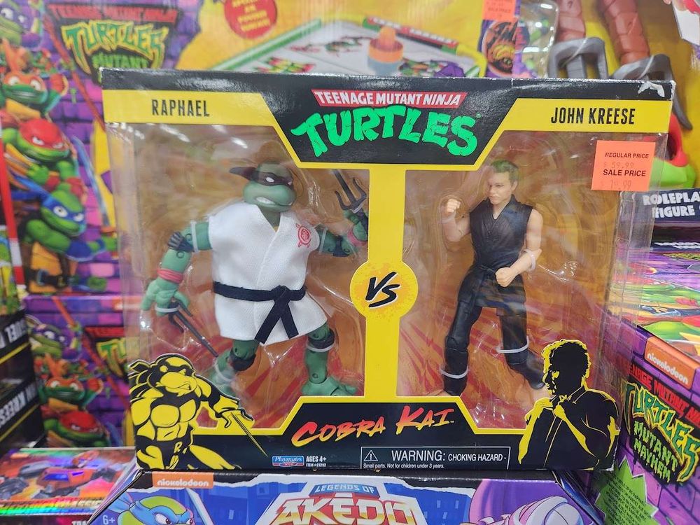 Action figure 2 pack. Raphael from Teenage mutant ninja turtles and John Kreese from Cobra Kai. The Raphael figure is in a white gi with a black belt.