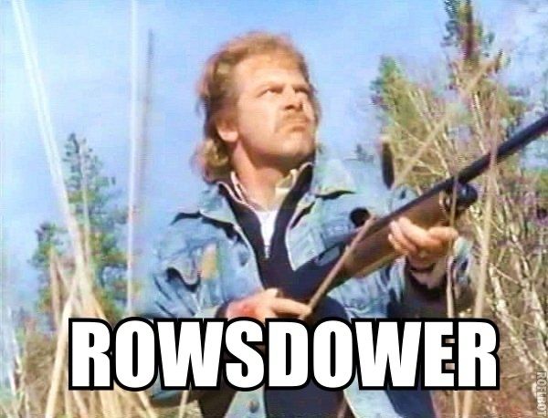 Zap ROWSDOWER from movie The Final Sacrifice, holding a rifle and wearing all denim 