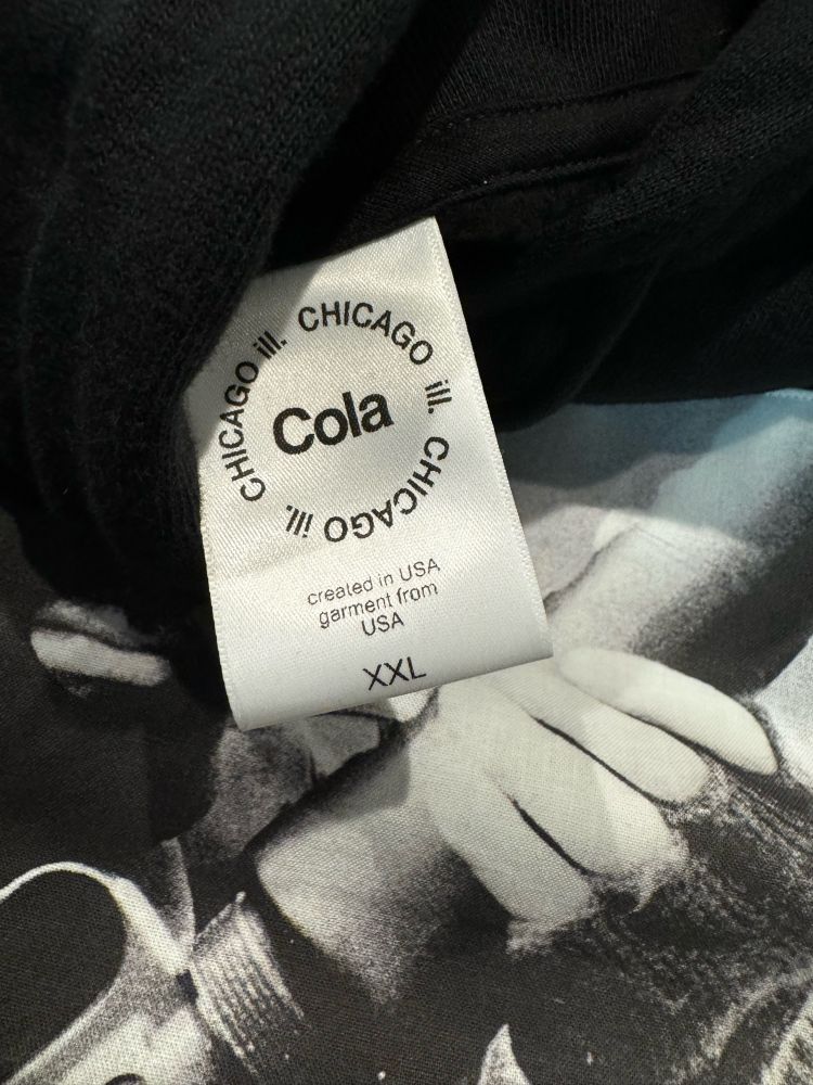 Hoodie neck tag reading: Created in USA / garment from USA. Includes Cola logo. 