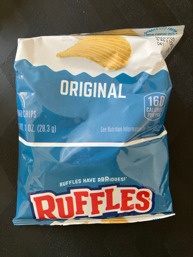 Individual size bag of ruffles potato chips, cut and sealed incorrectly so the logo is on the bottom, possibly the only one in existence!