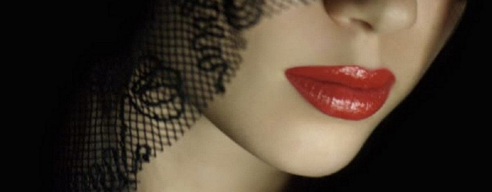Red lips; black lace veil...