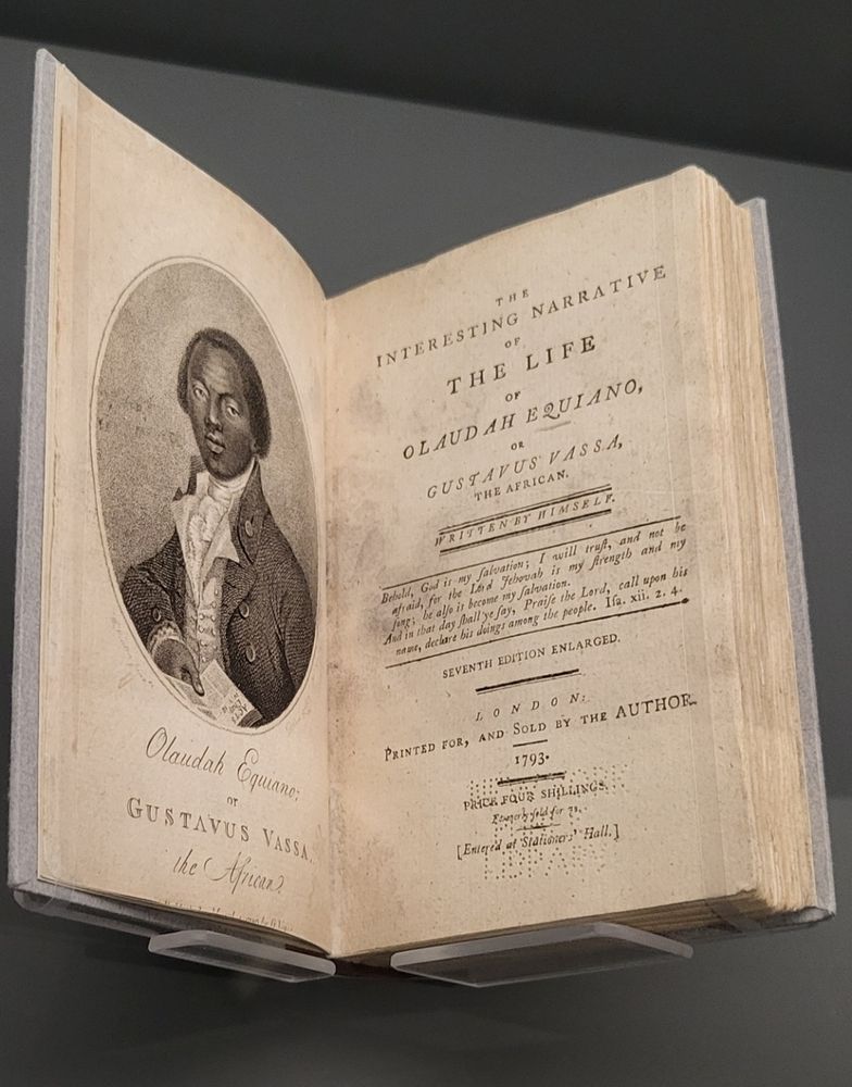 rare copy of "The Interesting Narrative of Olaudah Equiano, or Gustavus Vassa, the African, Written by Himself" by Olaudah Equiano, 1793 with illustration of distinguished African man in the high collard and tailored jacket style of the day, holding a book.

on loan from Schomburg Center for Research in Black Culture, The