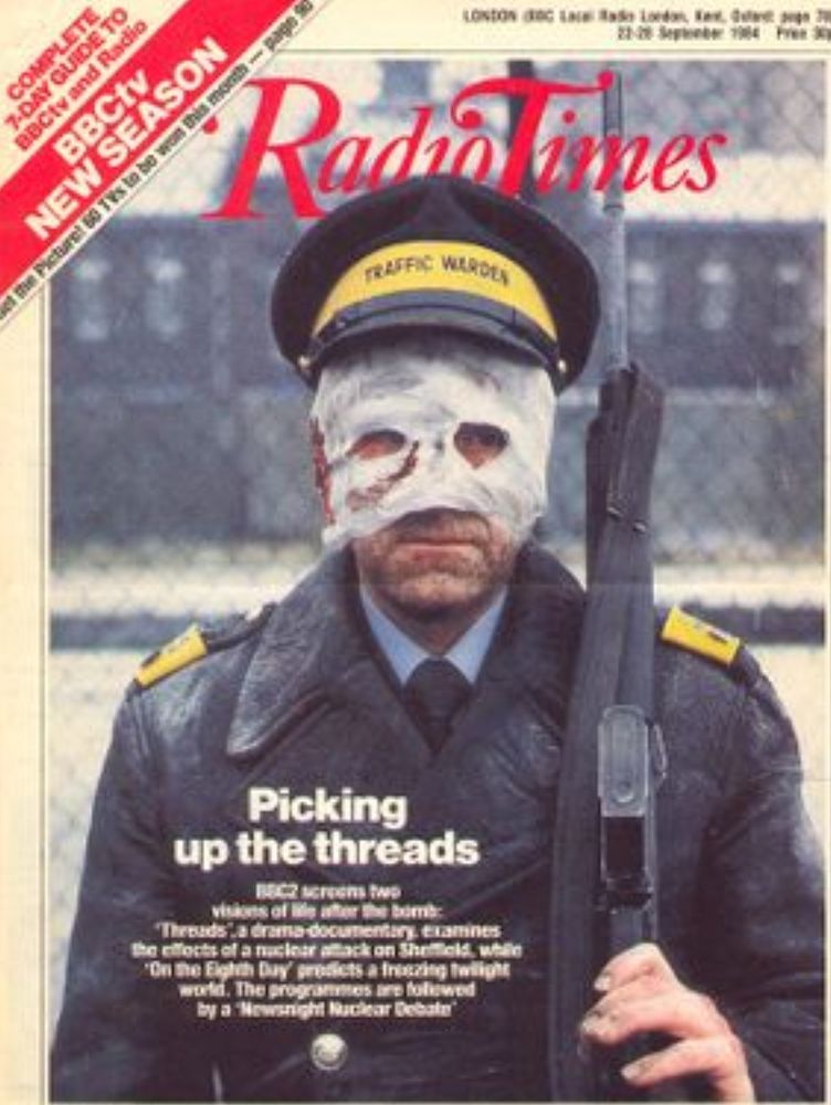 Front cover of the Radio Times depicting the iconic scene of the armed traffic warden with a bandaged face from the terrifying apocalyptic war drama Threads.