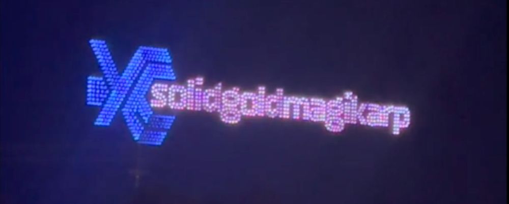 A drone show spelling out the phrase "solidgoldmagikarp"