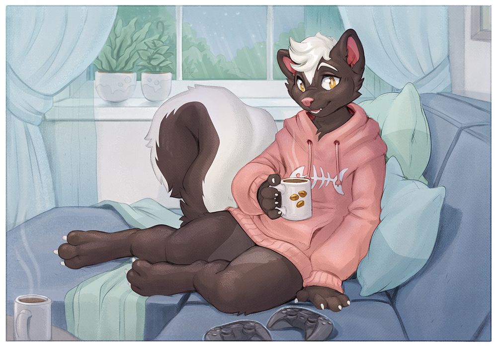skunk in comfy hoodie on a couch with two game controllers on it, holding a hot cup of coffee. He's looking at you and smiling, there is another cup of coffee on a table next to you