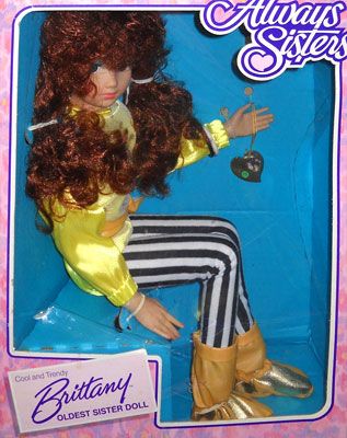 An Always Sisters doll in her box. She is called Brittany. She looks like she would shank you in your sleep.