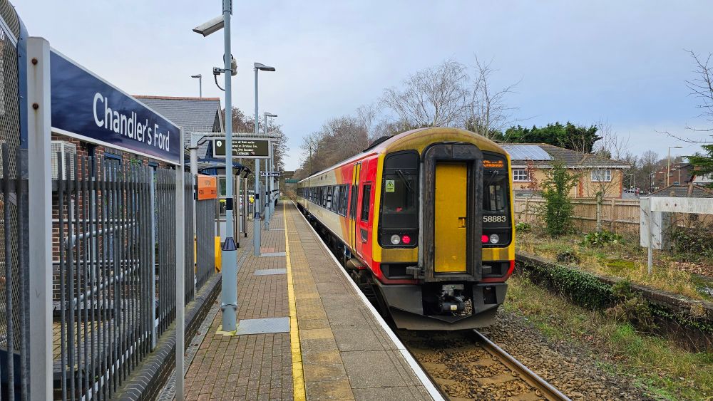 Chandlers Ford station with a Class 158 departing direct to Romsey