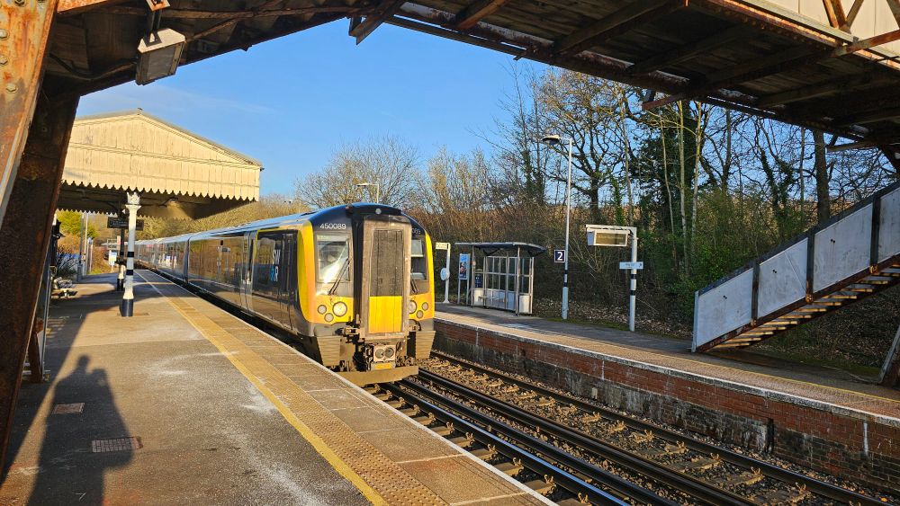 Bentley station with a South Western Railway train departing