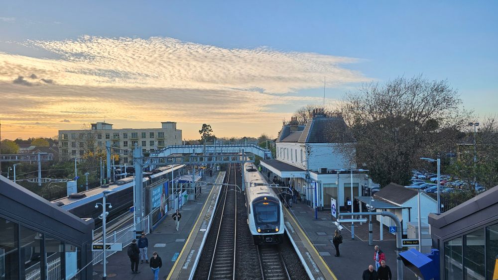 Langley station taken from the new footbridge. And Elizabeth Line train is pulling into the station next to the main station building