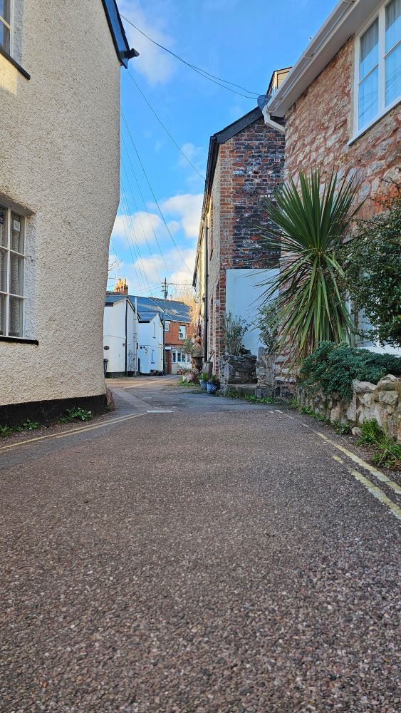 A narrow street in Lympstone with houses either side