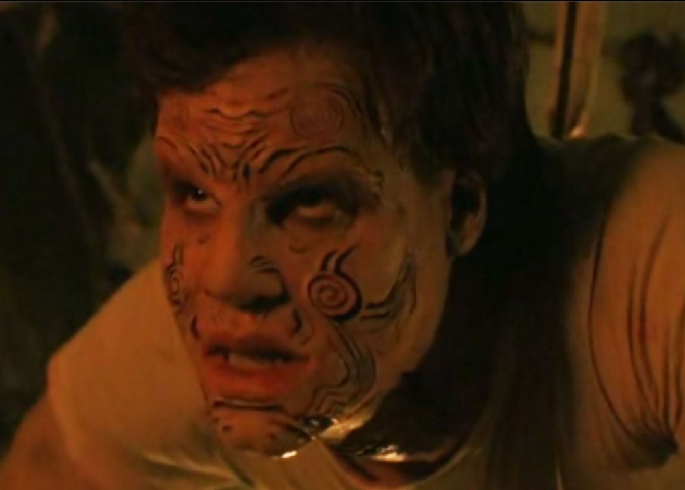 Craig Sheffer as Nightbreed's Boone, snarling and transformed with sigils on his face