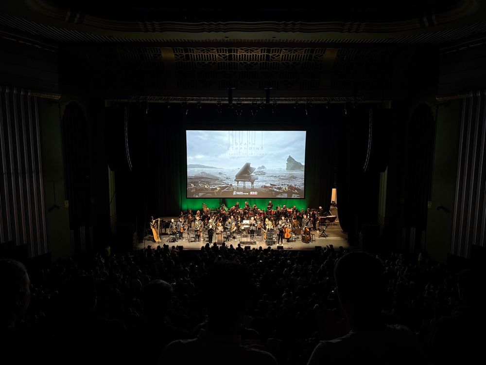 A shot from the audience of Death Stranding Live looking at the stage during a standing ovation