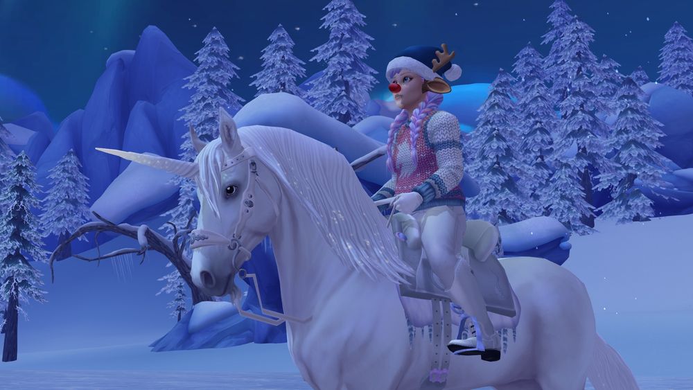 White Sylvian Star Stable unicorn in the Winter Village. Player character with reindeer antlers and ears and a pink and blue unicorn sweater.