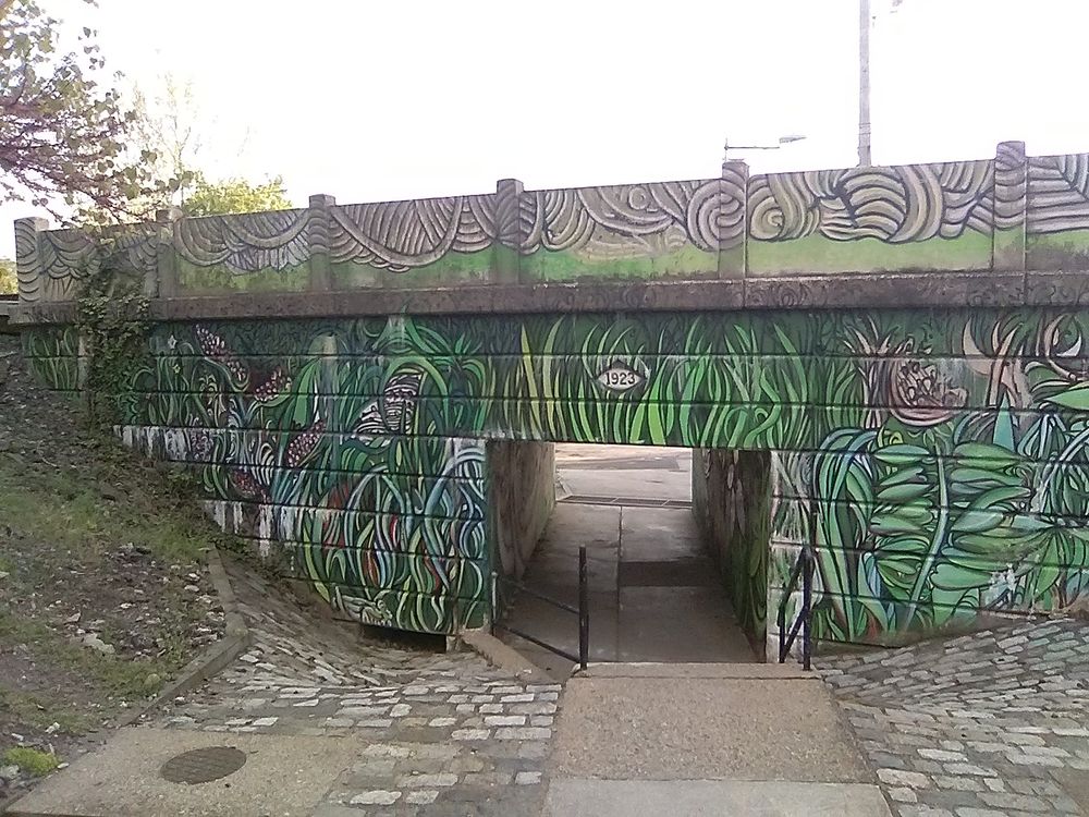 Painted regional rail bridge.