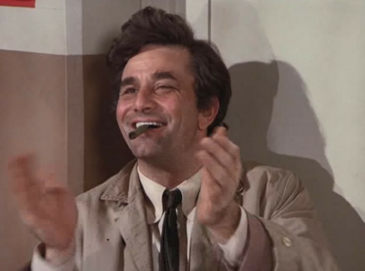 Lieutenant Columbo smiling with a cigar between his teeth, his hands are in mid clap. 