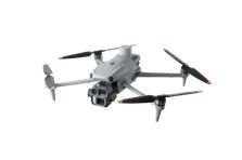 A picture of a gray quadcopter drone with prominent cameras on a white background.