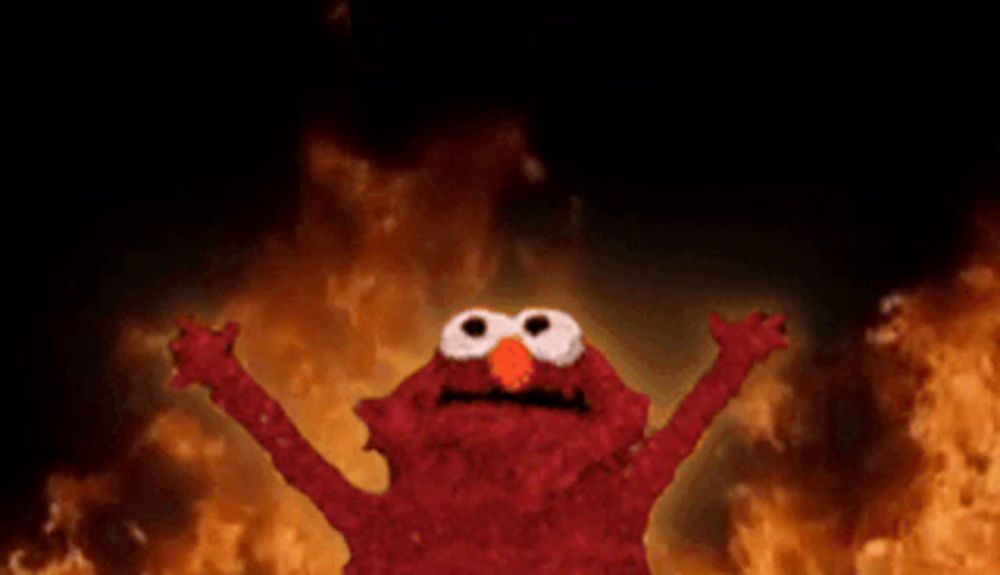 elmo from sesame street is standing in front of a fire with his arms outstretched