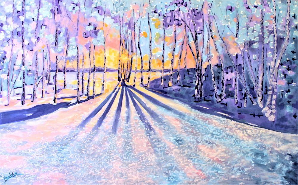 A sunset with light streaming through trees in lavenders and ice blues on the snow