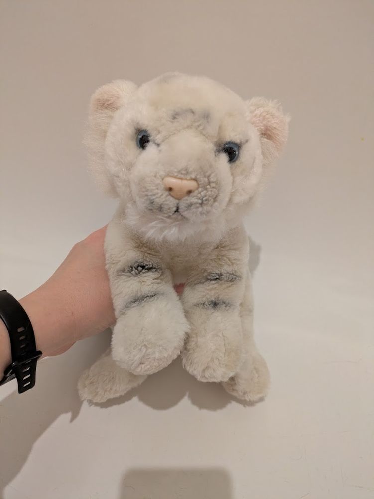 The same white plush tiger, now way whiter because he has been cleaned