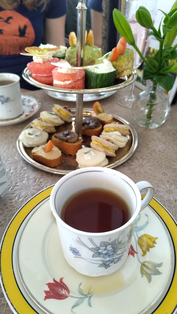 Cup of tea and a stand of treats. If you look carefully you can see my herby scone in the top right.