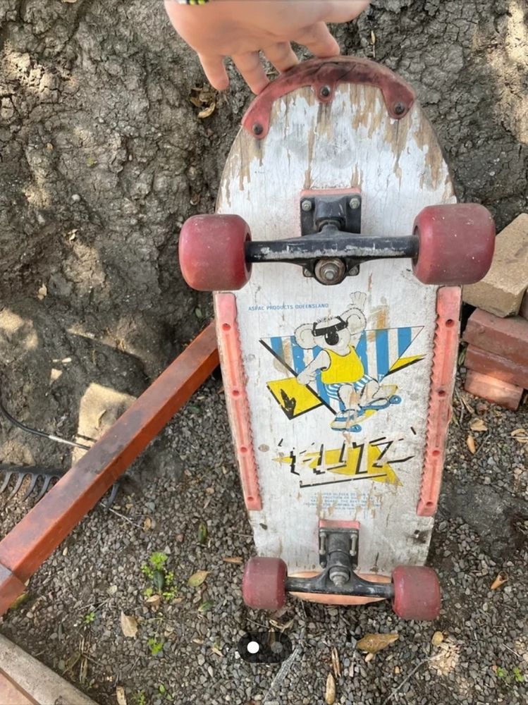 90's skateboard wood with old roller skate wheels. 