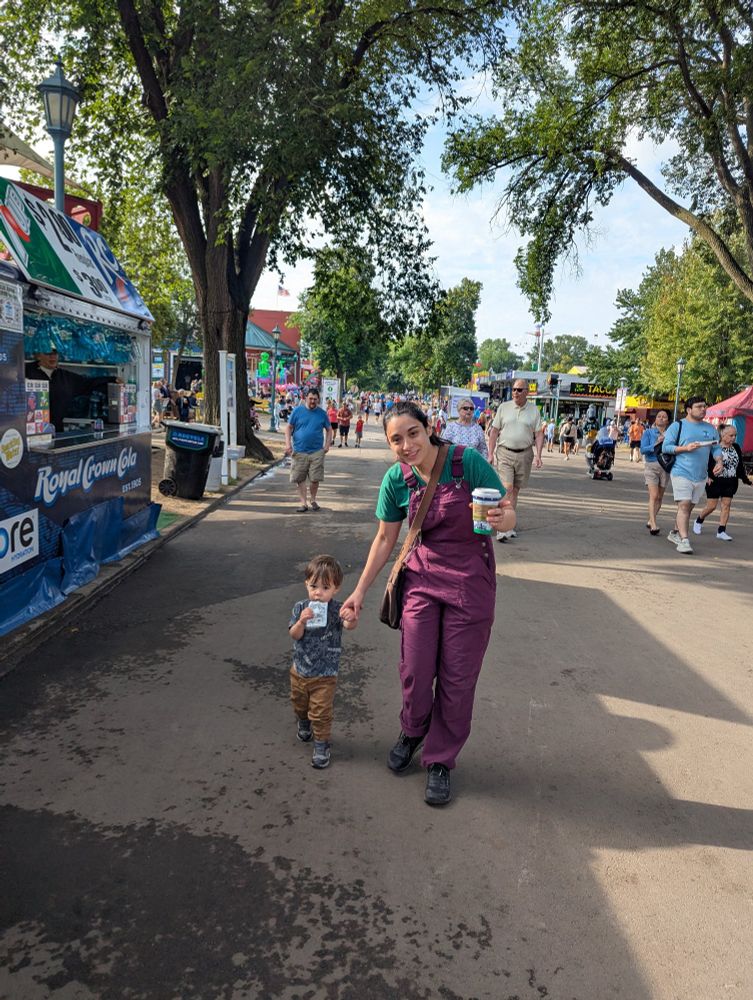Sam and Wyatt walking through the MN State Fair.