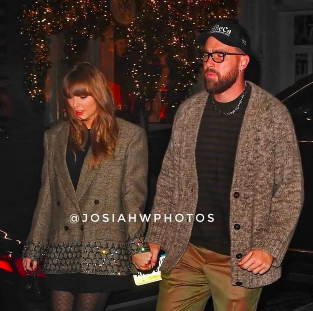 travis and taylor holding eachother’s hands
