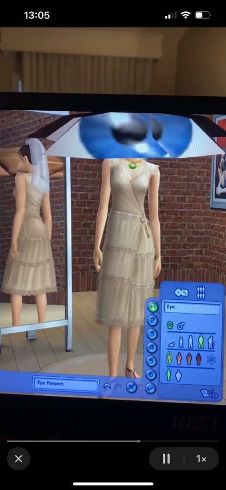 print de the sims 2 com uma personagem com um olho comicamente grande