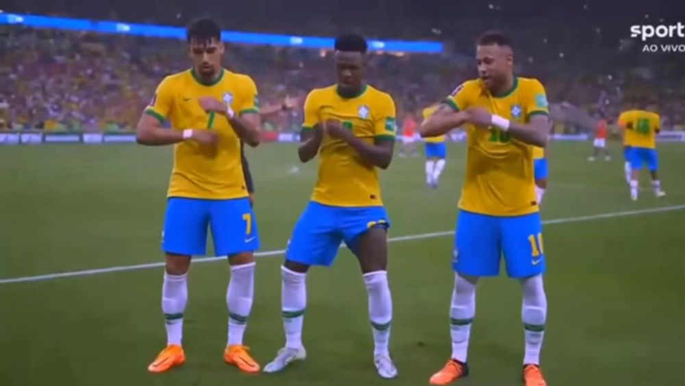 a group of soccer players are celebrating on the field