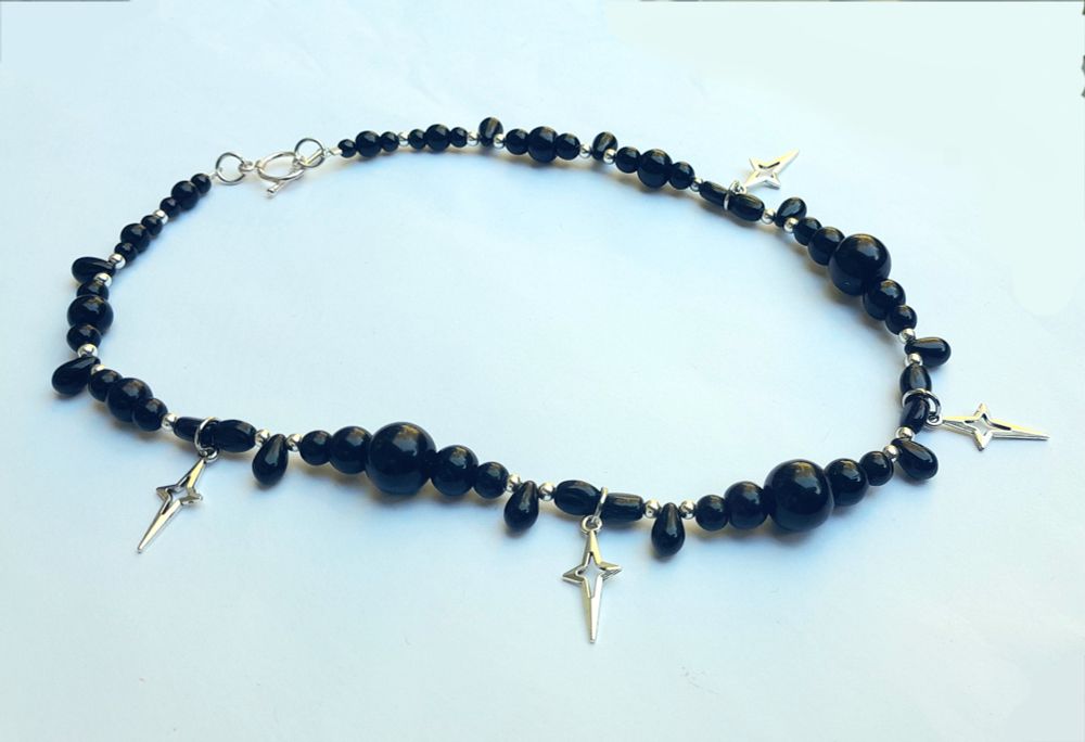 17.5" necklace with vintage glass and silver-plated beads, metal star pendants with a silver-coloured toggle clasp.