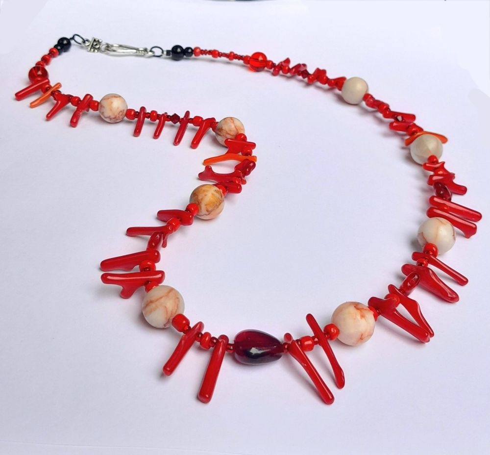 23" necklace with vintage coral, web rhoninite and glass beads with a silver-coloured hook clasp.