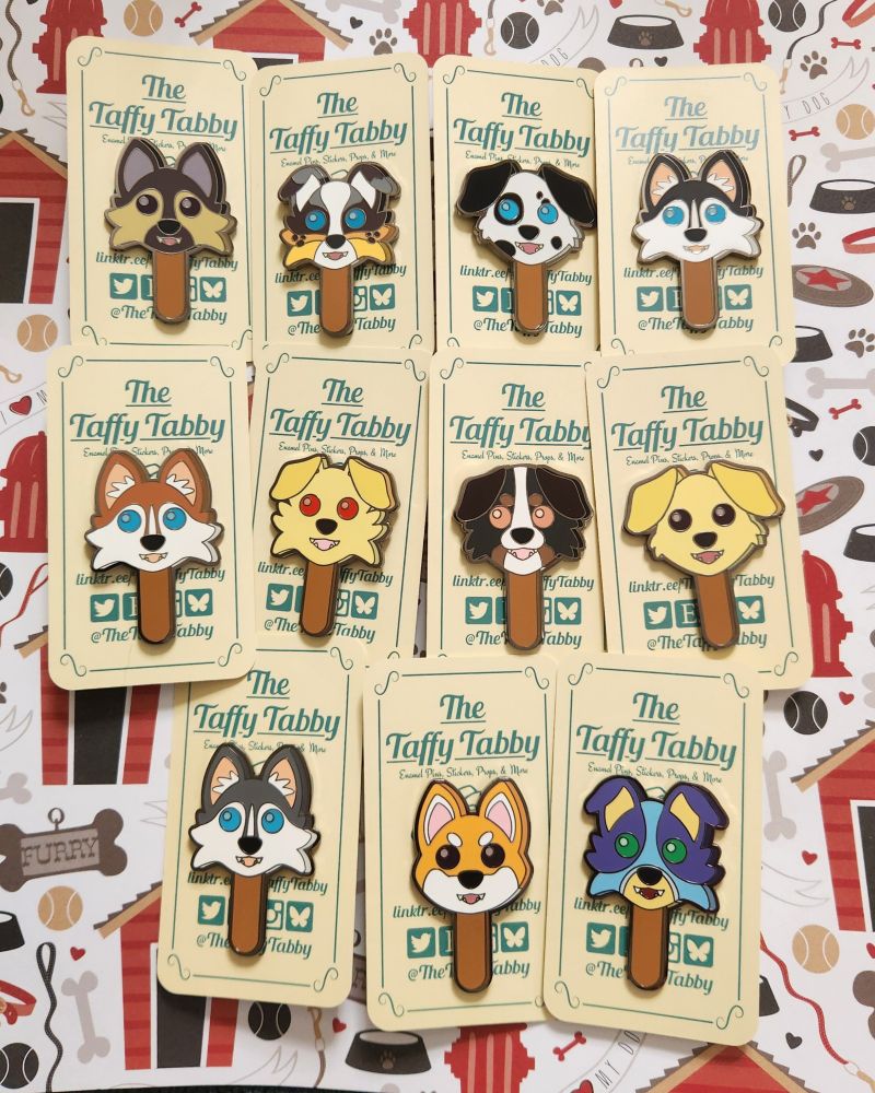 Enamel pins of various dog breeds as gumball Popsicles