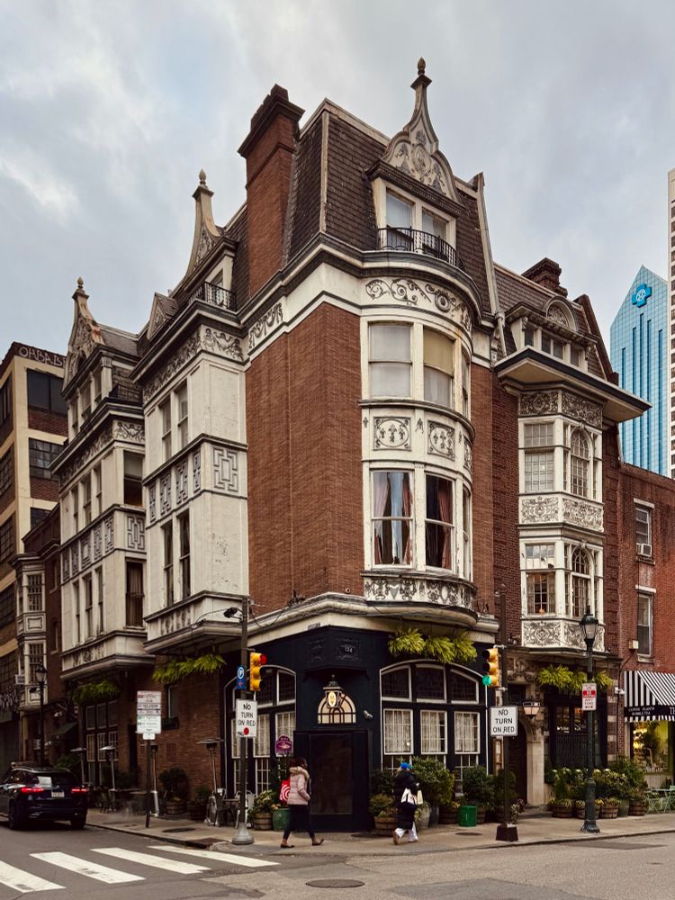 british pub style restaurant on street corner in picturesque victorian era mansion, off chestnut street in philly 