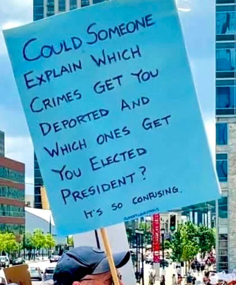 sign says: could someone explain which crimes get you deported and which ones get you elected president. it's so confusing.