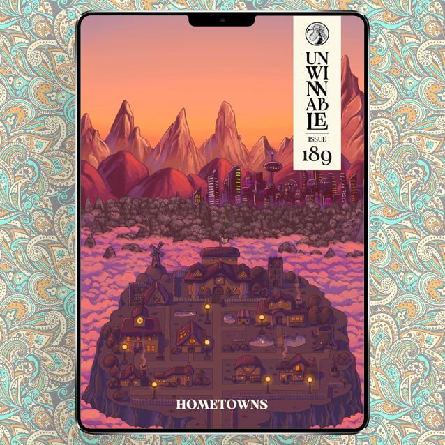 The cover of the July 2025 issue of Unwinnable Monthly, featuring art of a humble town on an island with a bustling city across the water. Text at the bottom reads "Hometowns."