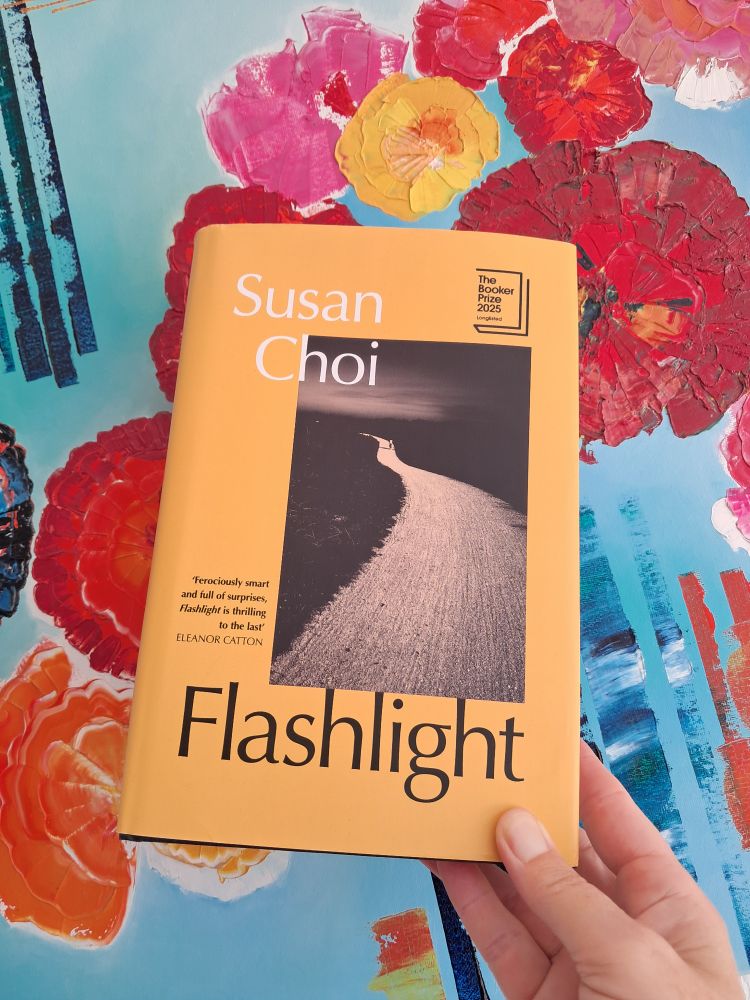 Flashlight by Susan Choi.
Background artwork by French artist Patricia Masuy.