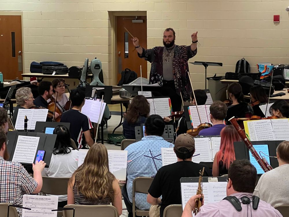 the orchestra and choir rehearsing, as seen from a musician's perspective