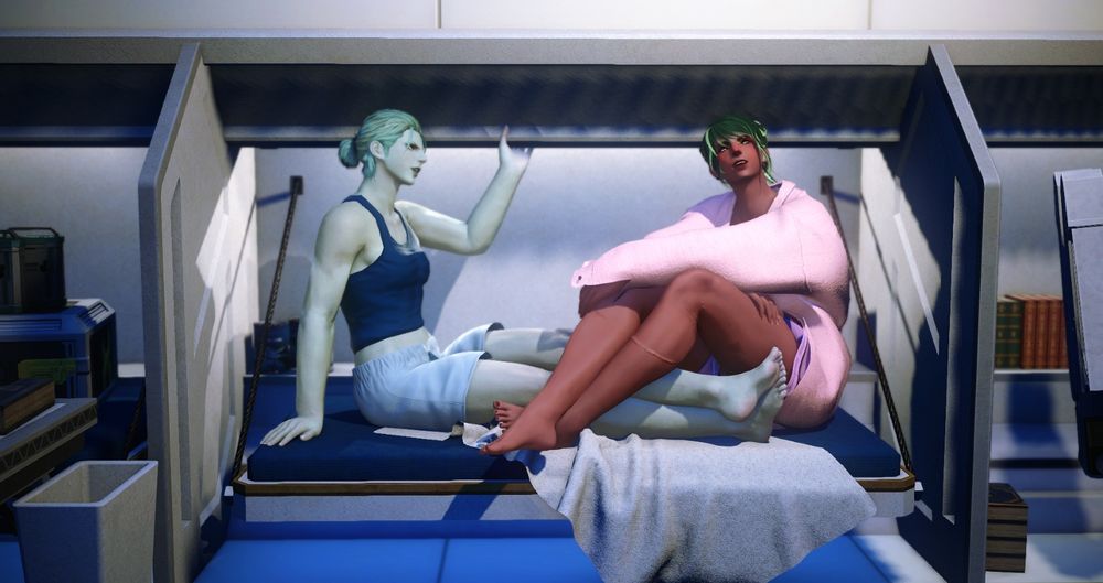 Two femroes sit in a cramped spaceship bunk, one dressed in a blue tank and shorts and the other in an oversized pink shirt and purple shorts. They look like they're in conversation, with the green-haired one holding on to a low overhanging light panel. The other is looking thoughtfully at something else.