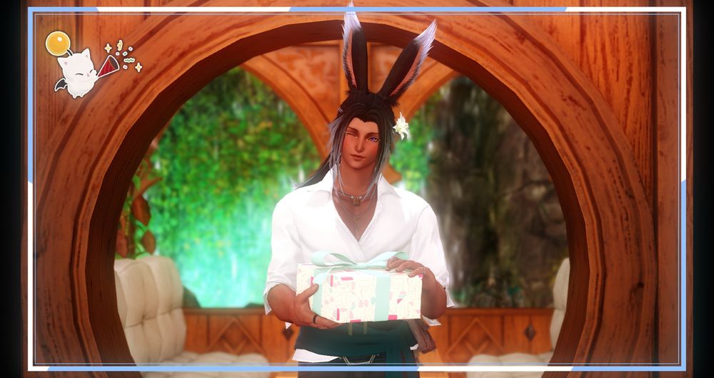 Ravnur, a brown-skinned Viera man, is pictured holding a birthday present and winking at the camera. He's standing indoors with a lush waterfall behind him. A blue and white border frames the picture with a birthday moogle sticker in the upper left corner.