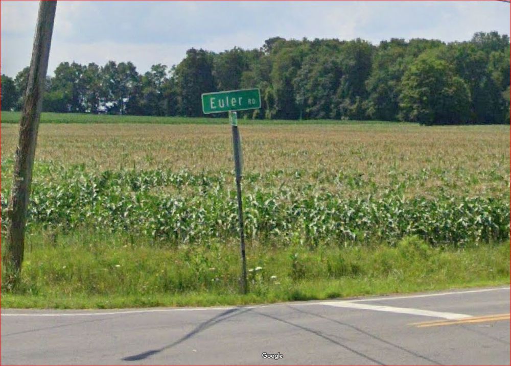 Euler Road sign in Churchville NY, with a cornfield in the background