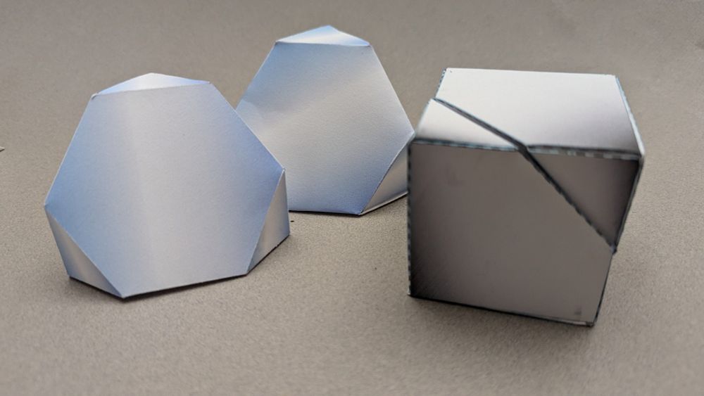 Diagonal halves of a cube, revealing hexagonal face