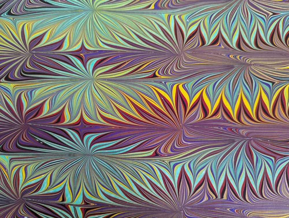 Marbled paper, called the Galen design after Galen Berry who figured out some super tricky moves to make this. 