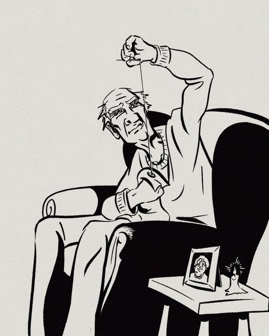 A black-and-white ink drawing of an elderly man sitting in an armchair, carefully sewing a button onto his sweater. His expression is one of quiet concentration tinged with sadness. On the small table beside him sits a lit candle and a framed photo of a smiling woman, suggesting she may have passed away. The scene conveys love, loss, and memory through a simple, intimate act.