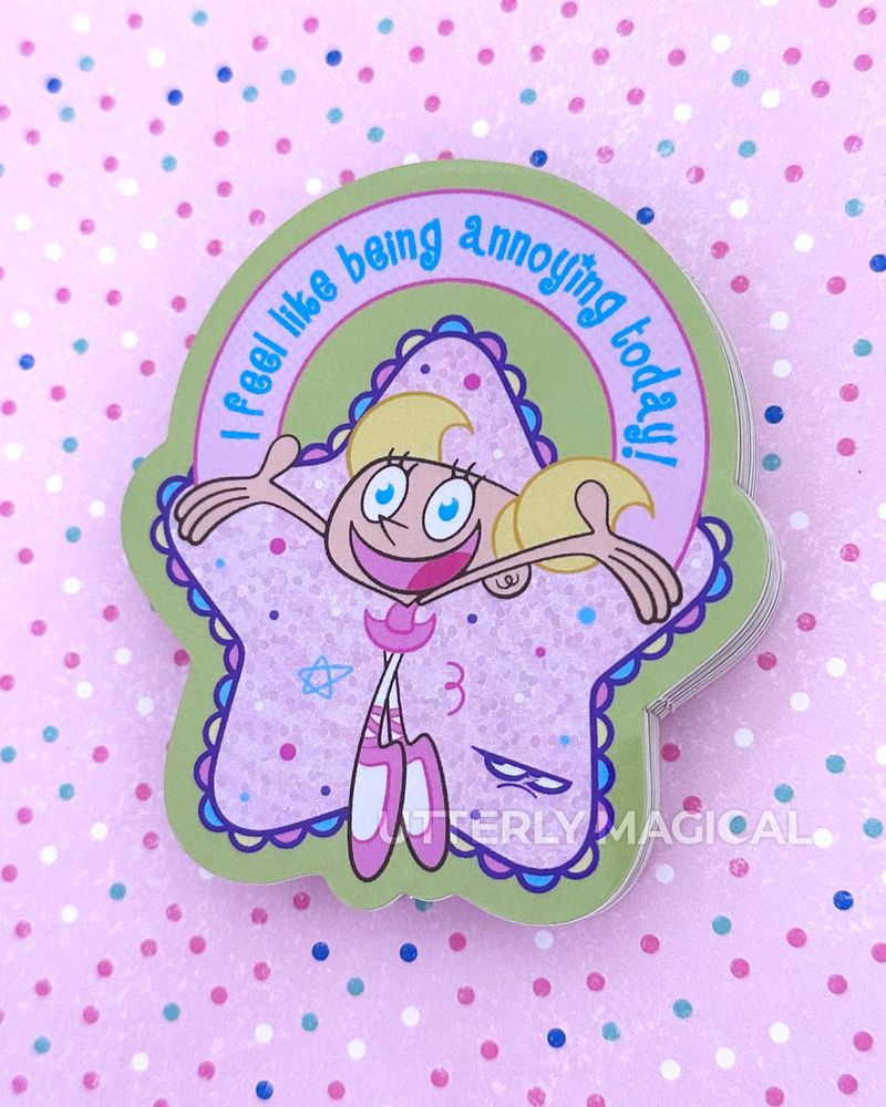 A stack of stickers on a pink polka dot background. 