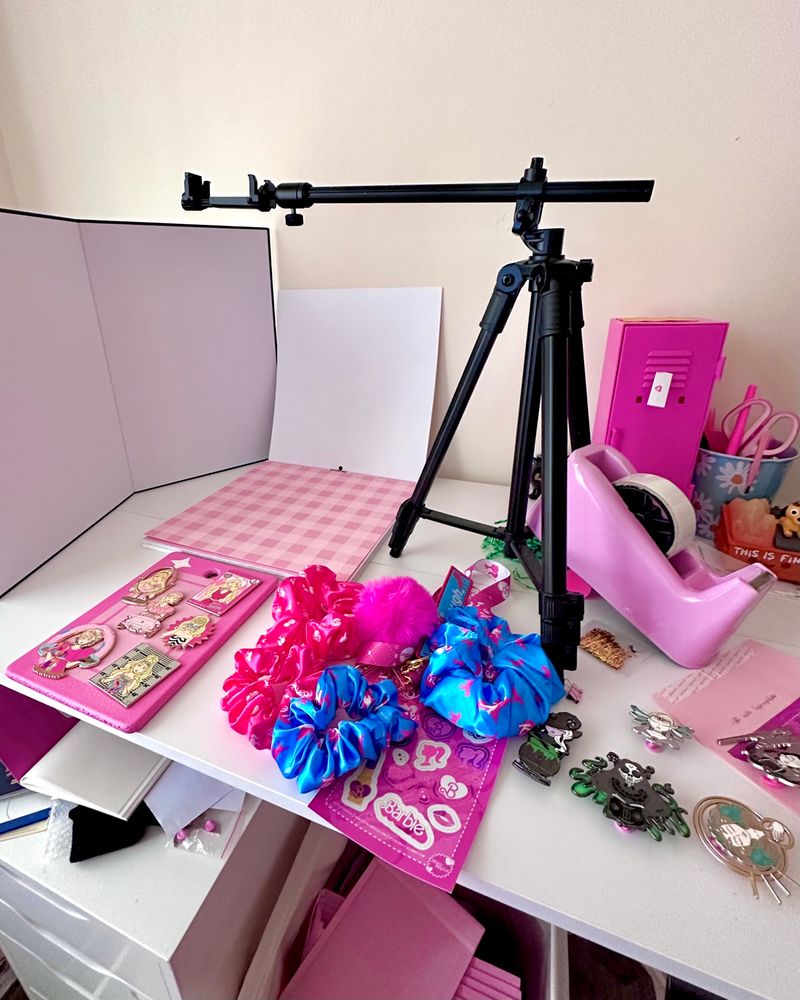 A messy desk with various items on it. 