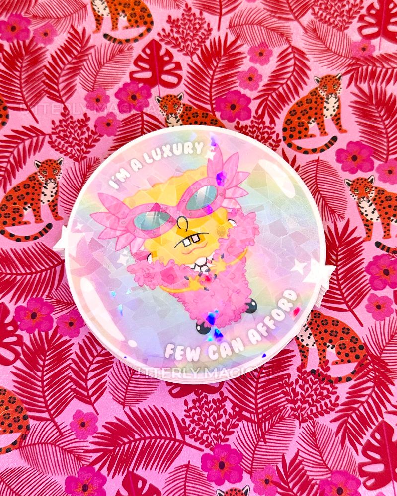 A sticker on a pink background with mixed media. 